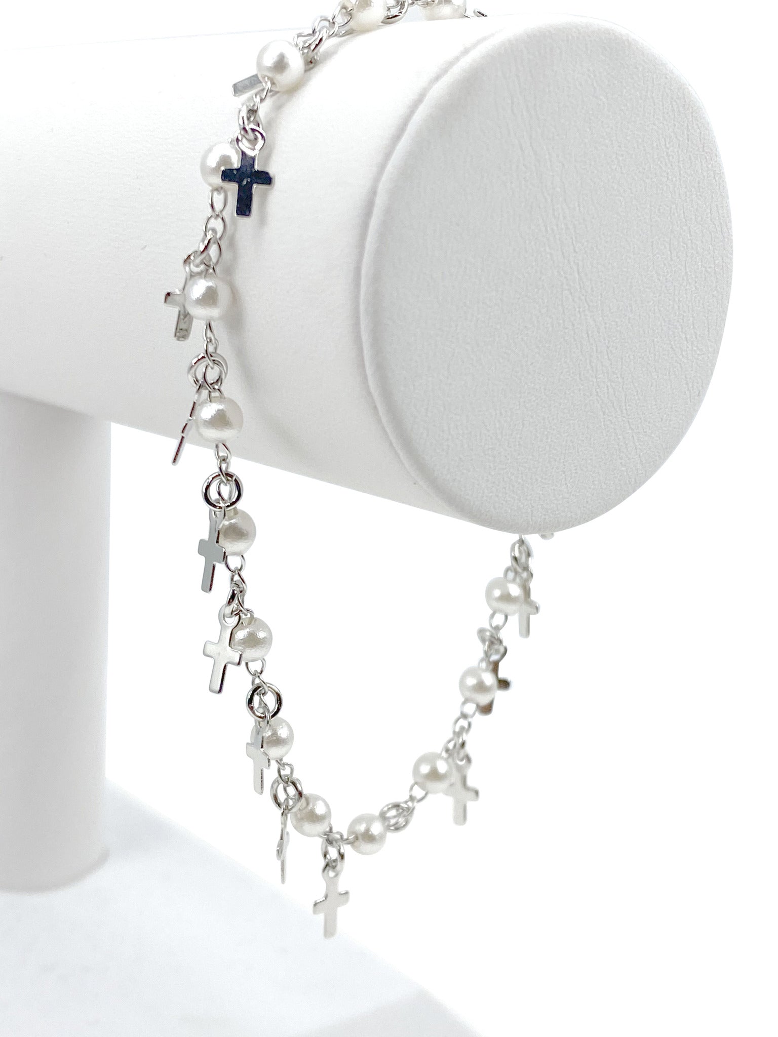 Bracelet  with simulated pearls and  crosses charms